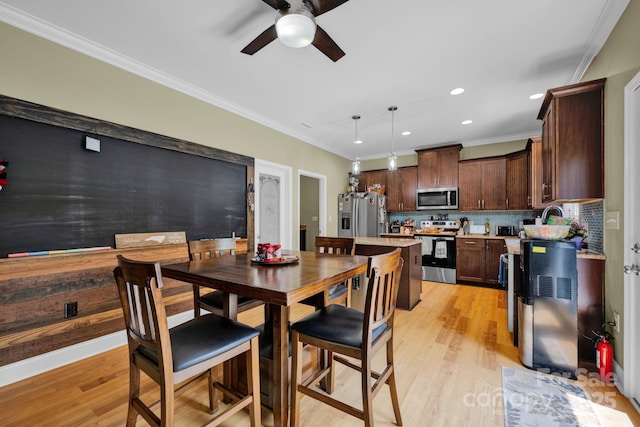 226 Stockwood Ln, Stanley, NC 28164 - dining space with ceiling fan, light wood-type flooring, ornamental molding, and recessed lighting