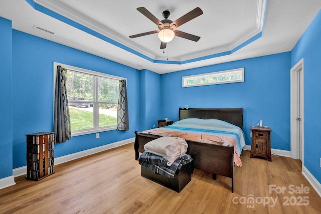226 Stockwood Ln, Stanley, NC 28164 - bedroom featuring a raised ceiling, ornamental molding, wood finished floors, baseboards, and a ceiling fan