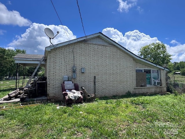 764 S Battleground Ave, Grover, NC 28073 - view of side of property featuring brick siding, a lawn, and cooling unit