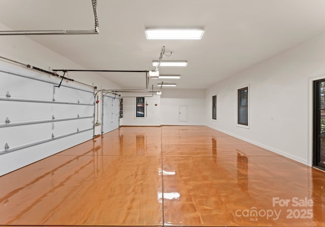 1220 Broadside Rd, York, SC 29745 - garage featuring baseboards and a garage door opener