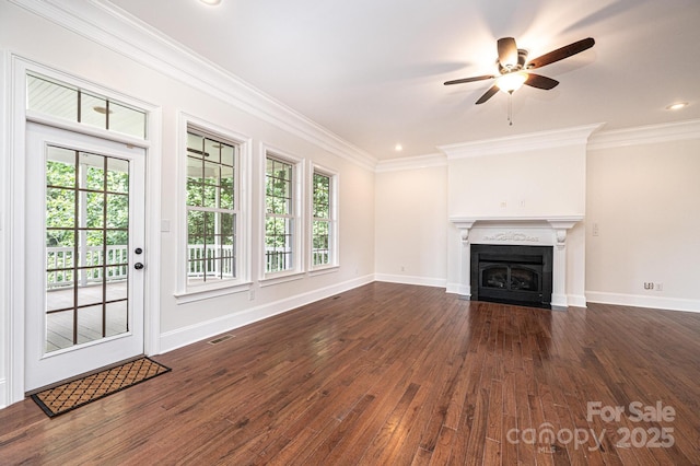4431 1st Street Dr NW, Hickory, NC 28601 - unfurnished living room with dark wood-style floors, plenty of natural light, a ceiling fan, a fireplace with flush hearth, and crown molding