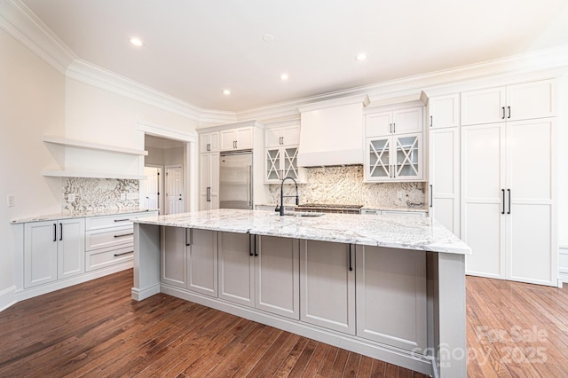 4431 1st Street Dr NW, Hickory, NC 28601 - kitchen featuring open shelves, built in refrigerator, a spacious island, a sink, and hardwood / wood-style floors
