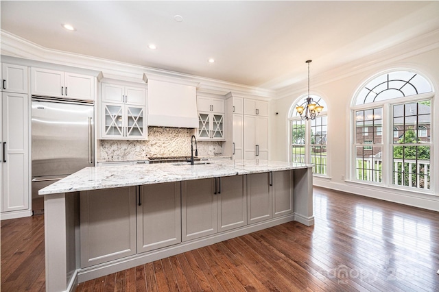 4431 1st Street Dr NW, Hickory, NC 28601 - kitchen featuring built in fridge, a spacious island, dark wood-style floors, a chandelier, and ornamental molding