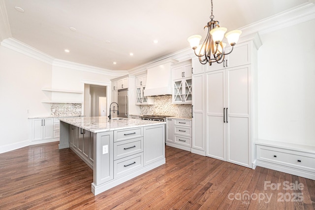 4431 1st Street Dr NW, Hickory, NC 28601 - kitchen with open shelves, a chandelier, ornamental molding, a kitchen island with sink, and tasteful backsplash