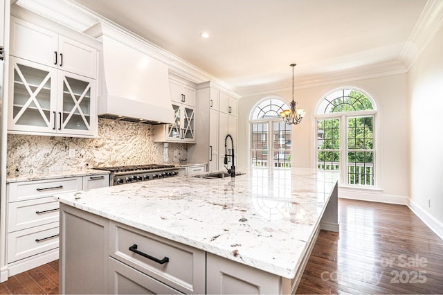 4431 1st Street Dr NW, Hickory, NC 28601 - kitchen with a sink, crown molding, dark wood finished floors, a spacious island, and a chandelier