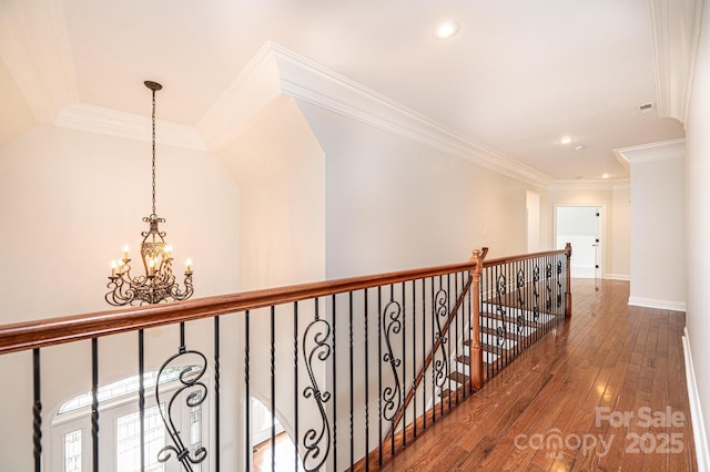 4431 1st Street Dr NW, Hickory, NC 28601 - hall with a chandelier, wood-type flooring, an upstairs landing, recessed lighting, and crown molding