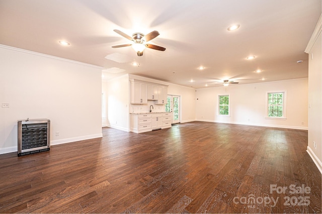4431 1st Street Dr NW, Hickory, NC 28601 - unfurnished living room with a ceiling fan, wine cooler, crown molding, dark wood-style flooring, and recessed lighting