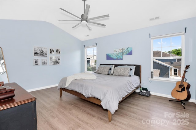 2210 Winding River Dr, Charlotte, NC 28214 - bedroom with wood finished floors, vaulted ceiling, ceiling fan, and baseboards