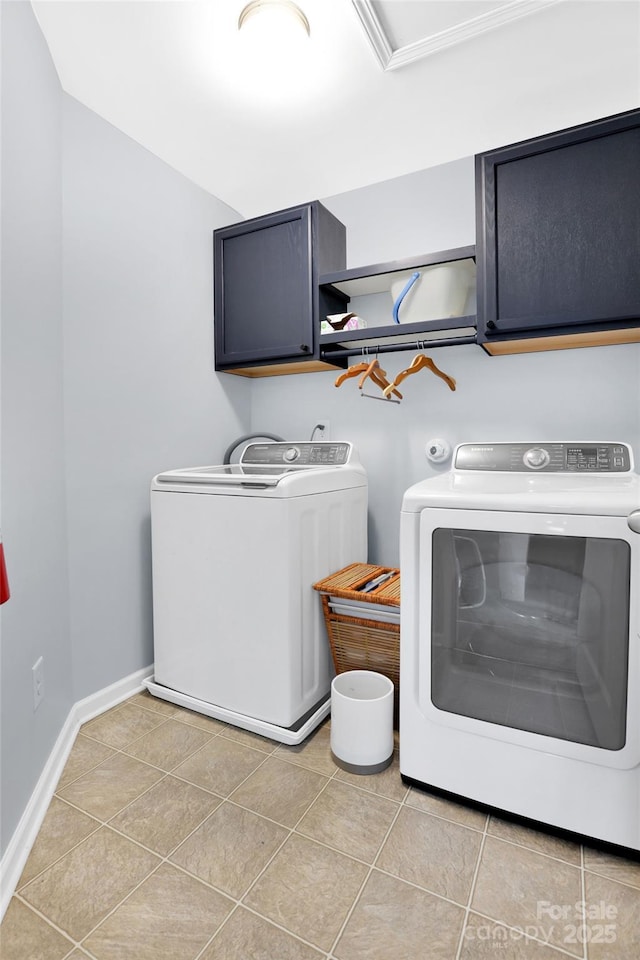 2210 Winding River Dr, Charlotte, NC 28214 - laundry area featuring cabinet space, independent washer and dryer, light tile patterned flooring, and baseboards