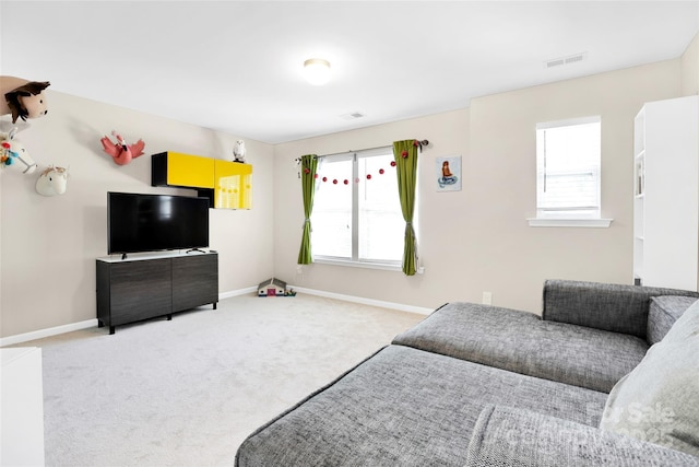 2210 Winding River Dr, Charlotte, NC 28214 - bedroom featuring multiple windows, carpet floors, and baseboards