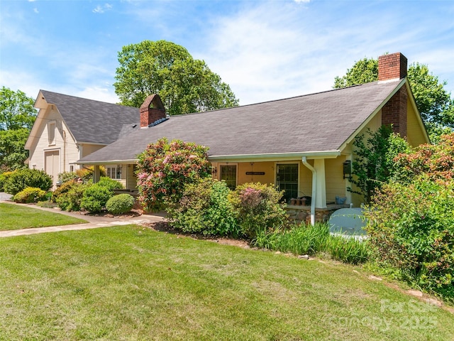 229 Crabtree Mountain Rd, Canton, NC 28716 - view of front facade with a chimney, a front lawn, and a shingled roof