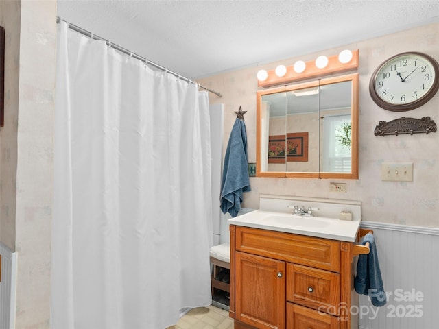 229 Crabtree Mountain Rd, Canton, NC 28716 - bathroom with vanity, a wainscoted wall, a textured ceiling, and curtained shower
