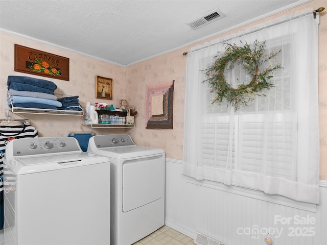 229 Crabtree Mountain Rd, Canton, NC 28716 - laundry area with washer and dryer, wainscoting, a textured ceiling, and ornamental molding