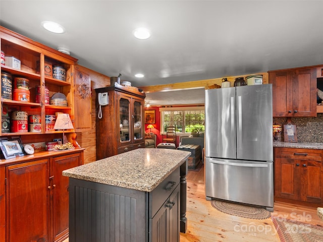 229 Crabtree Mountain Rd, Canton, NC 28716 - kitchen with freestanding refrigerator, light wood finished floors, a kitchen island, recessed lighting, and light stone countertops