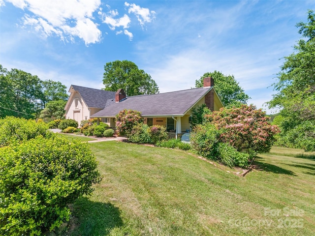 229 Crabtree Mountain Rd, Canton, NC 28716 - view of front of home with a chimney and a front lawn