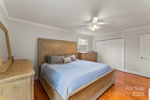 34 Westridge Dr, Asheville, NC 28803 - bedroom featuring light wood-style floors, crown molding, a closet, and a ceiling fan
