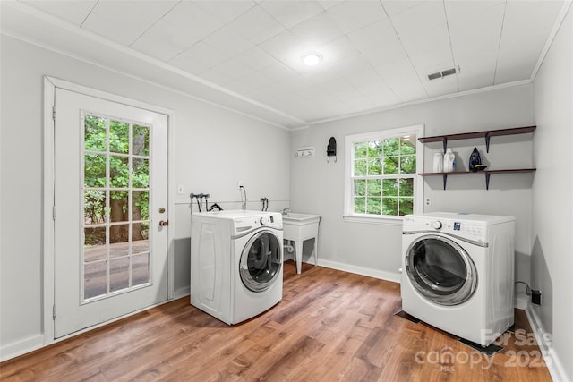 34 Westridge Dr, Asheville, NC 28803 - laundry room with light wood-type flooring, washing machine and clothes dryer, baseboards, and ornamental molding