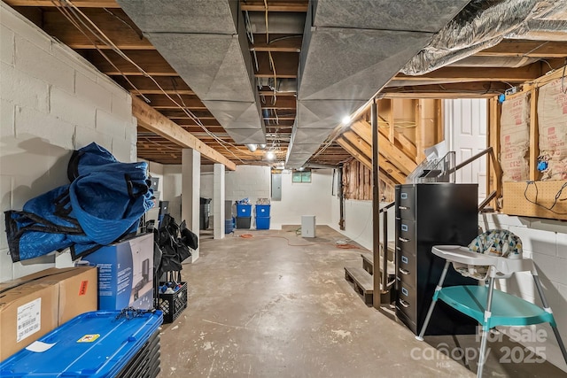 34 Westridge Dr, Asheville, NC 28803 - unfinished below grade area with electric panel and concrete block wall