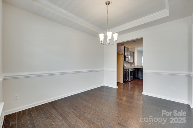 4051 Whittier Ln, Fort Mill, SC 29708 - empty room featuring a chandelier, dark wood-style floors, a tray ceiling, baseboards, and crown molding