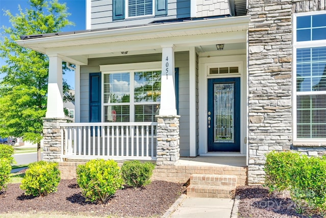 4051 Whittier Ln, Fort Mill, SC 29708 - property entrance featuring covered porch and stone siding