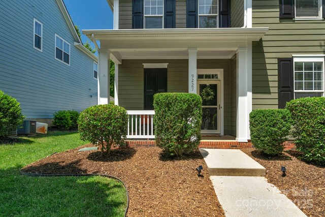 9227 Island Overlook Ct, Cornelius, NC 28031 - view of exterior entry featuring covered porch
