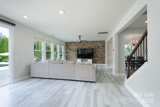 1211 Gold Rush Ct, Fort Mill, SC 29708 - living room with light wood-style floors, a chandelier, stairway, and baseboards
