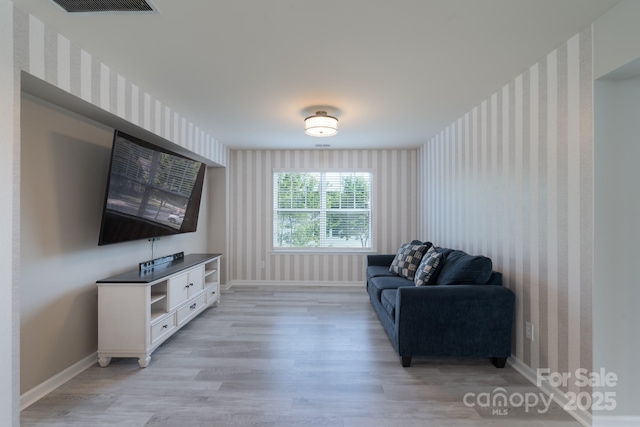 1211 Gold Rush Ct, Fort Mill, SC 29708 - living room featuring wallpapered walls, light wood-style floors, and baseboards