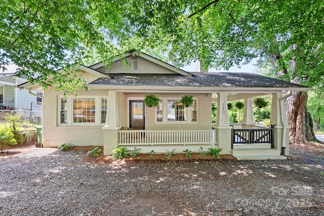 140 Pennsylvania Ave, Asheville, NC 28806 - view of front of property with brick siding, a porch, and roof with shingles