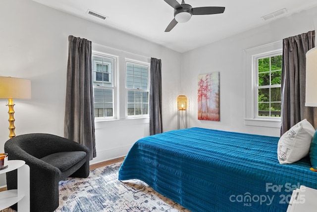 140 Pennsylvania Ave, Asheville, NC 28806 - bedroom with wood finished floors, ceiling fan, and baseboards