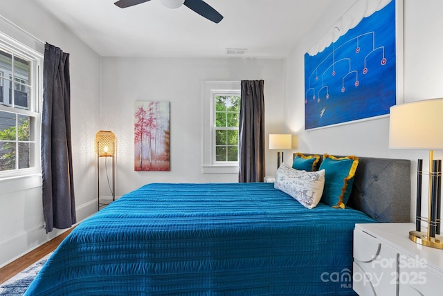 140 Pennsylvania Ave, Asheville, NC 28806 - bedroom with wood finished floors, a ceiling fan, and baseboards