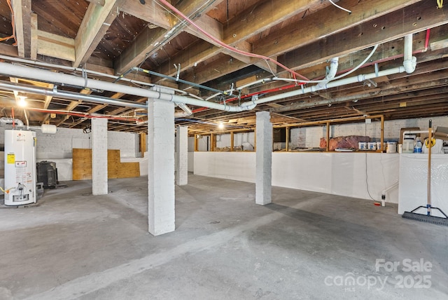 140 Pennsylvania Ave, Asheville, NC 28806 - unfinished below grade area featuring gas water heater and washer / clothes dryer