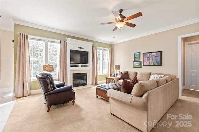 8115 Wilburn Ct, Charlotte, NC 28277 - living room featuring ceiling fan, crown molding, a fireplace with flush hearth, baseboards, and light colored carpet