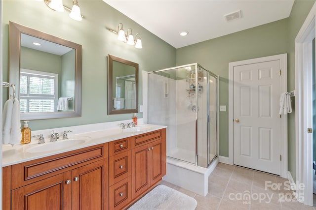 8115 Wilburn Ct, Charlotte, NC 28277 - bathroom with a stall shower, double vanity, and tile patterned floors