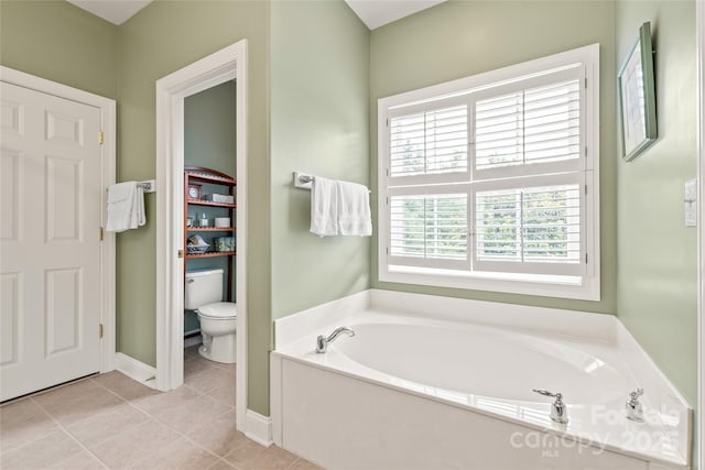 8115 Wilburn Ct, Charlotte, NC 28277 - full bathroom featuring a garden tub, toilet, tile patterned floors, and baseboards