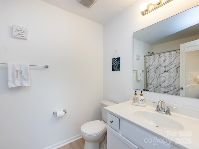 13422 Calloway Glen Dr, Charlotte, NC 28273 - bathroom featuring vanity, toilet, wood finished floors, a shower with shower curtain, and baseboards