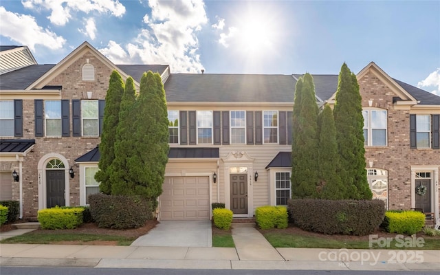 6416 Union Station Ct, Charlotte, NC 28210 - multi unit property featuring an attached garage, driveway, a standing seam roof, and a metal roof