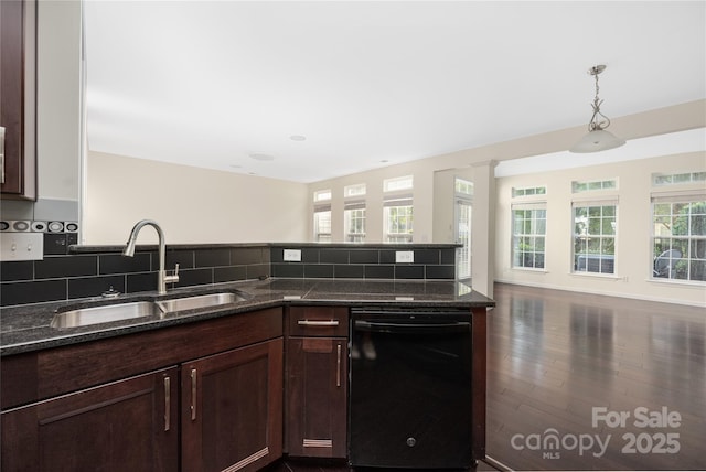 6416 Union Station Ct, Charlotte, NC 28210 - kitchen with black dishwasher, dark stone counters, dark wood-style floors, and backsplash