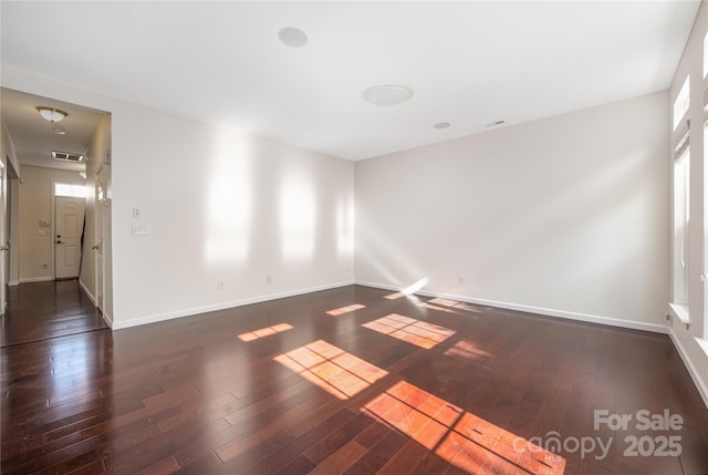 6416 Union Station Ct, Charlotte, NC 28210 - empty room featuring dark wood-type flooring and healthy amount of natural light