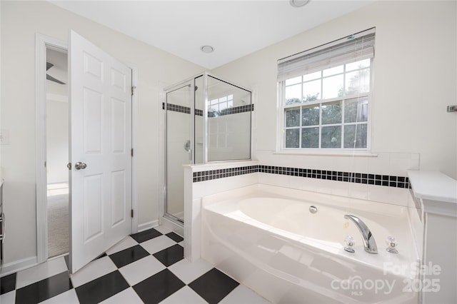 6416 Union Station Ct, Charlotte, NC 28210 - full bath featuring a garden tub, tile patterned floors, and a shower stall