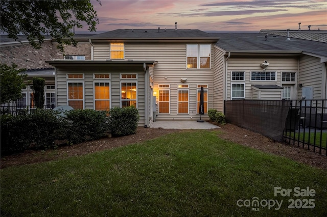 6416 Union Station Ct, Charlotte, NC 28210 - back of property at dusk with a patio