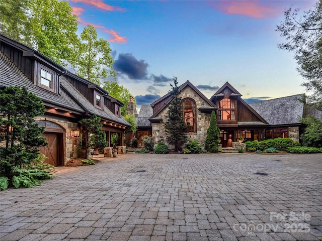 41 Chimney Pt, Lake Toxaway, NC 28747 - view of front of property featuring stone siding and decorative driveway