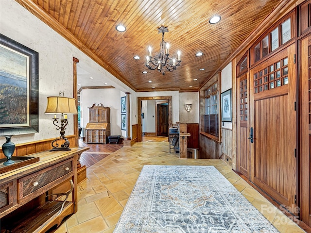 41 Chimney Pt, Lake Toxaway, NC 28747 - entryway with crown molding, recessed lighting, wooden ceiling, a chandelier, and stone tile flooring