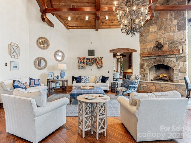 41 Chimney Pt, Lake Toxaway, NC 28747 - living room with wood finished floors, a fireplace, a chandelier, wood ceiling with exposed beams, and a high ceiling