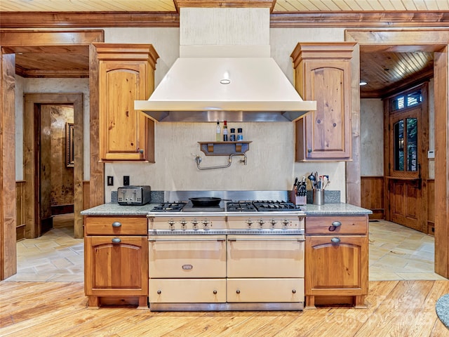 41 Chimney Pt, Lake Toxaway, NC 28747 - kitchen with double oven range, premium range hood, wood ceiling, crown molding, and light stone finish floors