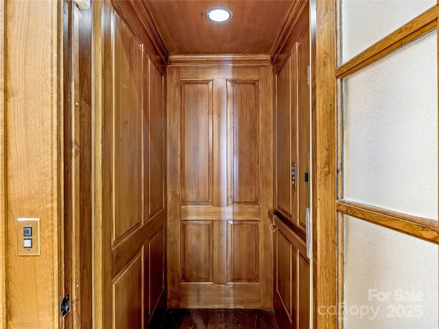 41 Chimney Pt, Lake Toxaway, NC 28747 - elevator featuring crown molding, wood walls, recessed lighting, and a decorative wall