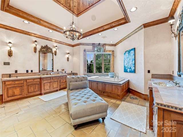 41 Chimney Pt, Lake Toxaway, NC 28747 - bathroom featuring two vanities, recessed lighting, crown molding, a chandelier, and a garden tub