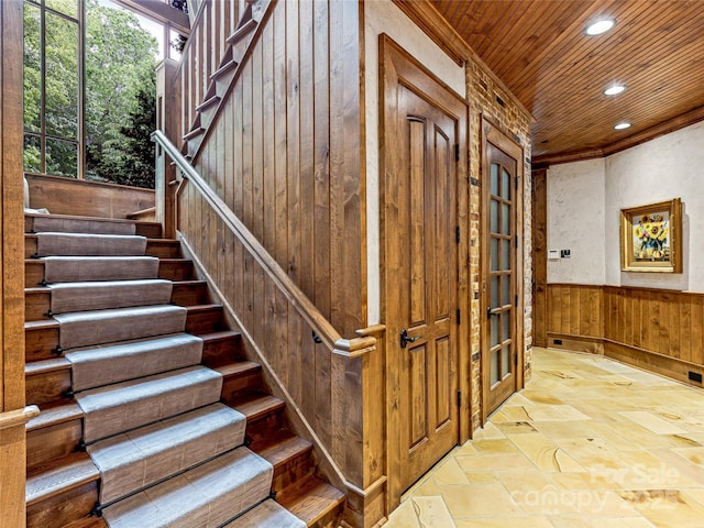 41 Chimney Pt, Lake Toxaway, NC 28747 - stairs featuring wooden walls, wooden ceiling, recessed lighting, and stone tile floors