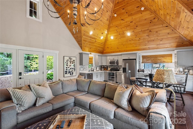 75 Indigo Bunting Ct, Tuckasegee, NC 28783 - living room with high vaulted ceiling, dark wood finished floors, a chandelier, healthy amount of natural light, and recessed lighting