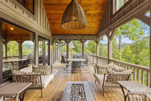 75 Indigo Bunting Ct, Tuckasegee, NC 28783 - wooden terrace featuring an outdoor living space, outdoor dining area, area for grilling, and a mountain view
