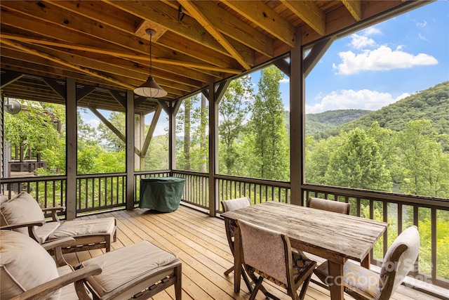 75 Indigo Bunting Ct, Tuckasegee, NC 28783 - wooden terrace with outdoor dining area and a wooded view